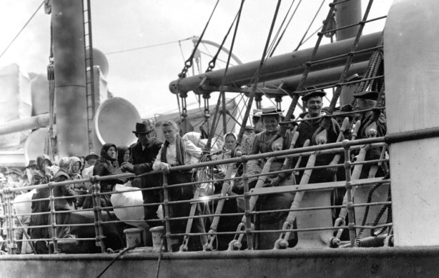 Immigrants at rail of steamship